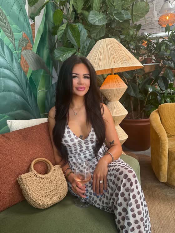 Madyson Meadows at a plant-filled restaurant