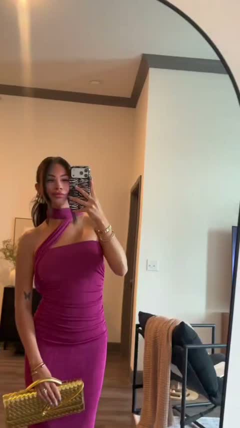 Mirror try-on in a magenta dress